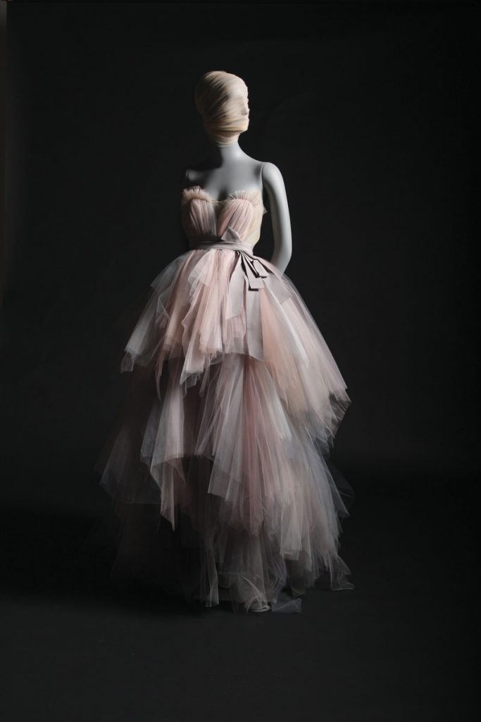The watercolor tulle gown is a Spring 2013 creation made from hand-layered tulle and a grosgrain belt