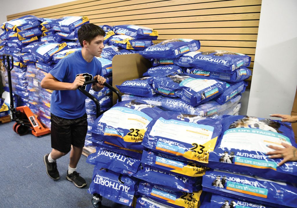 Hunter Pankiewicz, son of Ted Jr., has hopes of taking the nonprofit statewide to help more people and their pets. Photo by Kelly Rogers