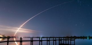 Propelled by an Atlas V rocket, an environmental satellite soars into space just after its 2016 launch from Kennedy Space Center. A joint venture of NASA and NOAA, it sends weather-related images back to Earth. The photo was taken from the end of Gifford Dock Road in Vero Beach. Photo by Sam Wolfe