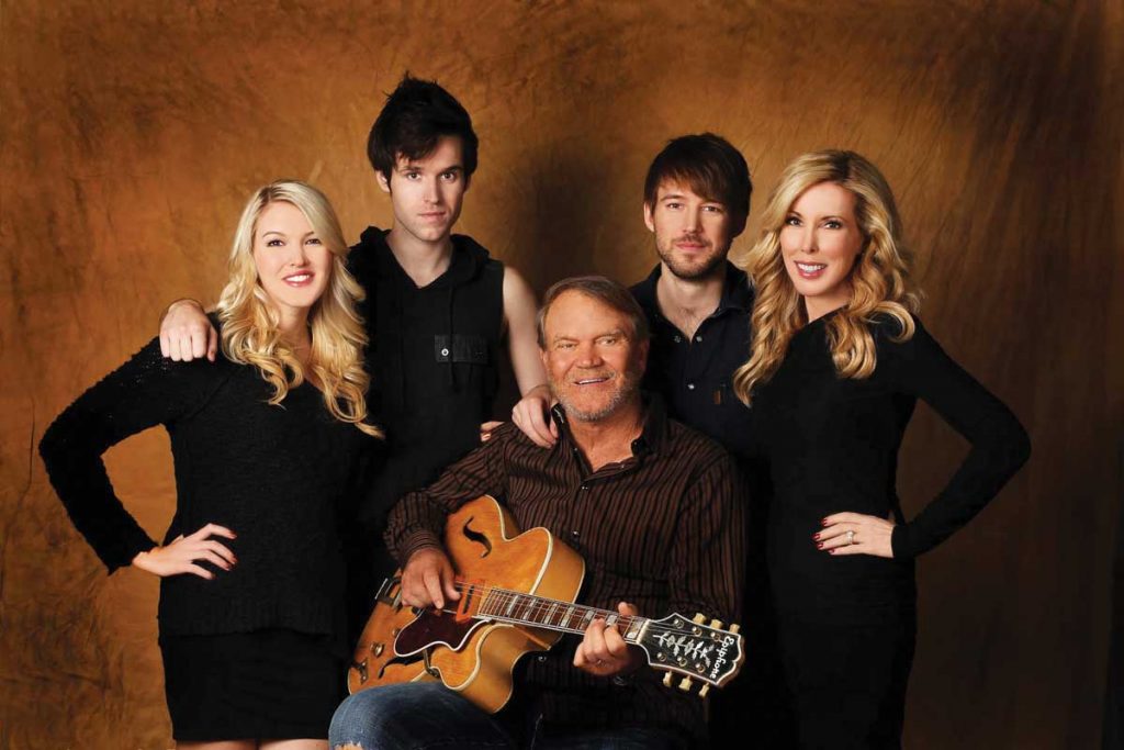 Legendary singer, songwriter, musician—and Alzheimer’s patient—Glen Campbell is surrounded by the family members who accompanied him on his final tour: daughter Ashley, sons Shannon and Cal, and wife Kim. “You have to find a support system,” Ashley says. Courtesy of Ashley Campbell