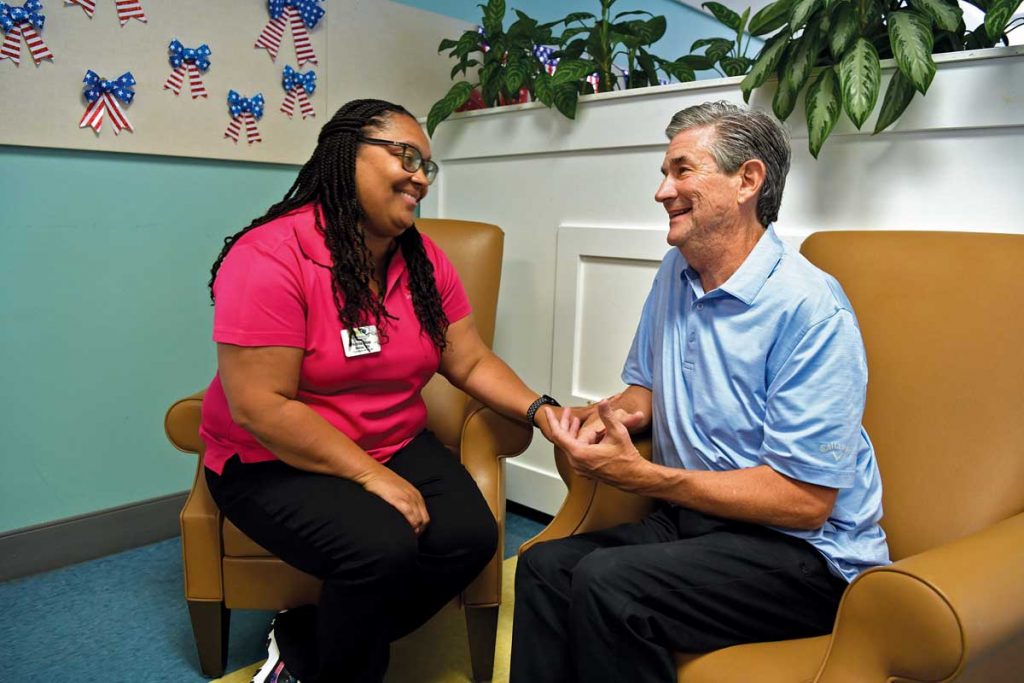 Longtime Senior Resource Association employee Annie Mae Stokes, LPN, is the DayAway program manager. Michael laughs with her daily and says, “We just call her ‘superstar.’” Photo by Kelly Rogers