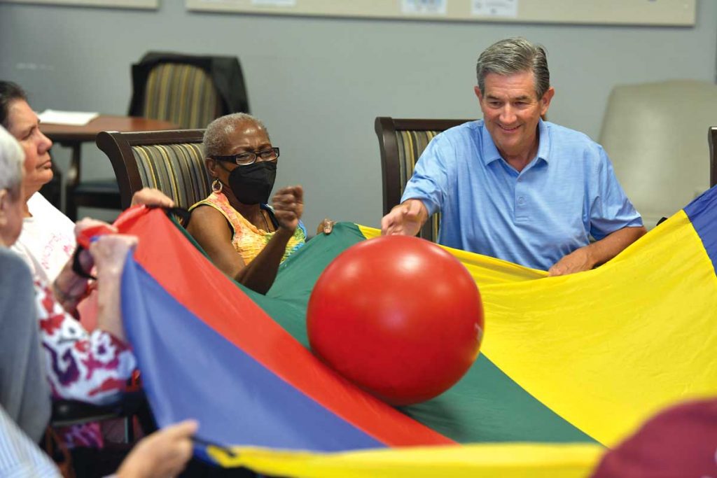 Michael and fellow DayAway attendee Lola practice hand-eye coordination during a fun activity. Photo by Kelly Rogers