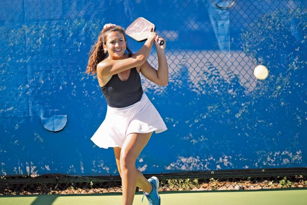 In addition to tournament play, Amanda Hendry coaches other players each week. Photo by Steven Martine
