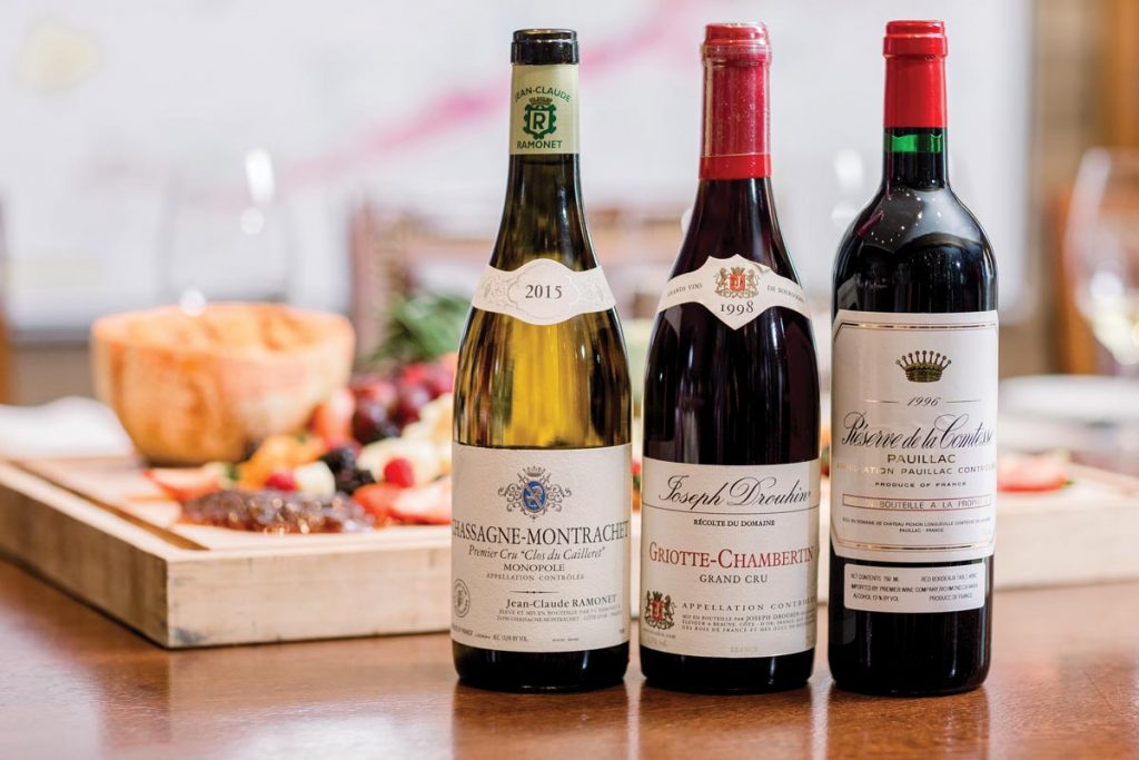 Chassagne-Montrachet Premier Cru Clos Du Cailleret, Joseph Drouhin Griotte-Chambertin Grand Cru, and Réserve de la Comtesse Pauillac. Photo by Verola Media
