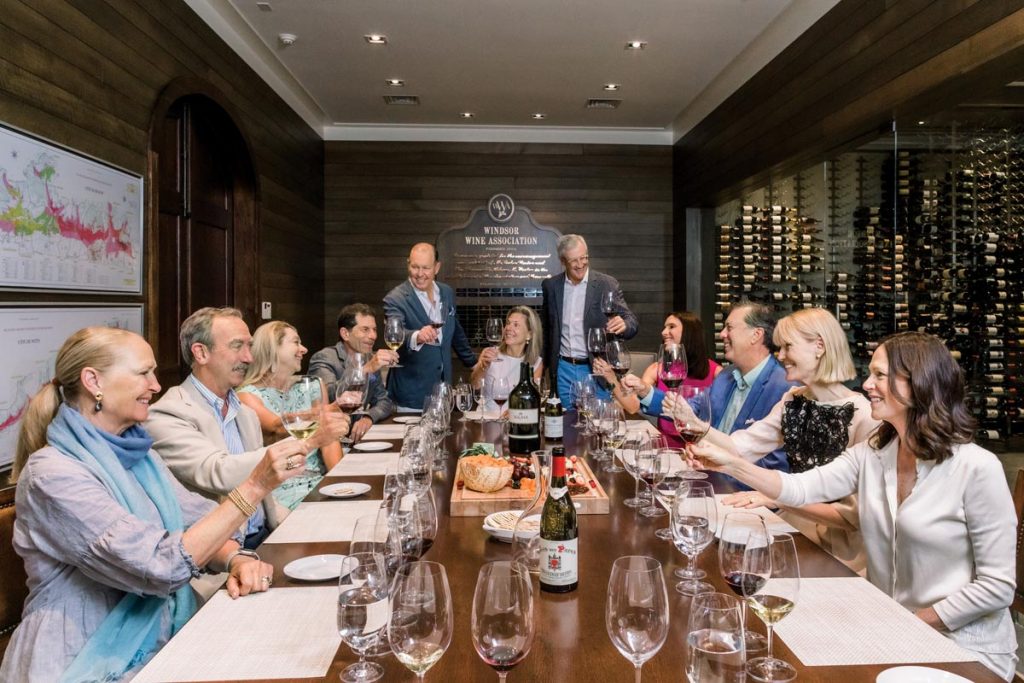 Suzanne Segalas, Rob Long, Susan Zimmer, Jon Rubinstein, Jeff Zimmer, Jodie King, Allan Dragone, Jennifer Williams, Bob King, Karen Richardson, and Susan Long enjoy a toast before the wine tasting. Photo by Verola Media