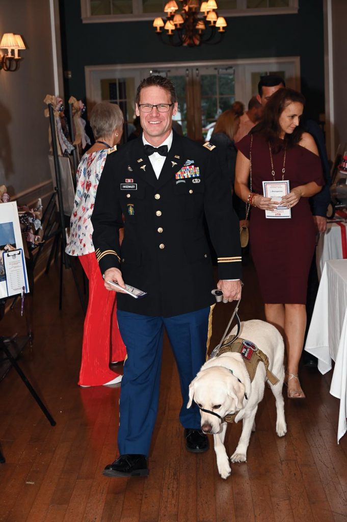 This military-themed dance and show benefiting Dogs for Life, which trains service dogs for veterans, will take place February 3 at Pointe West Country Club. Photo by Lee Orre