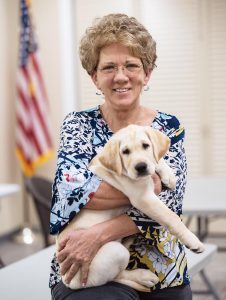 Dogs for Life founder and CEO Shelly Ferger introduces Ranger, a service puppy in training