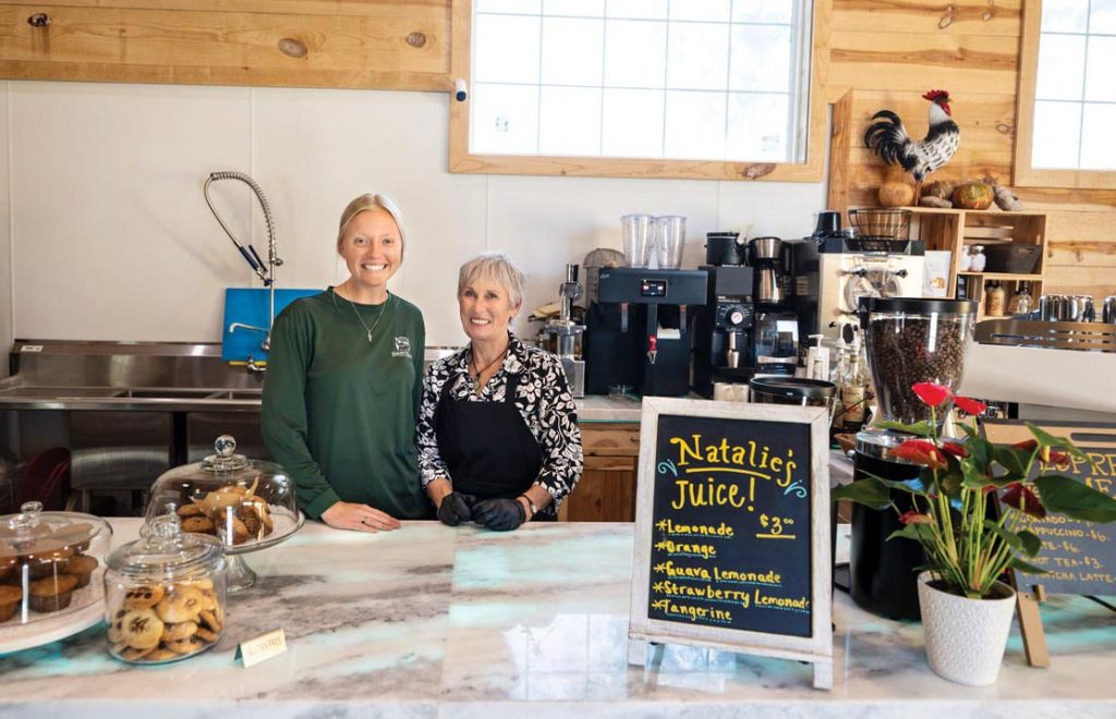 Mianna Baker and Romaine Frey greet café visitors at the farm. Photo by Steven Martine