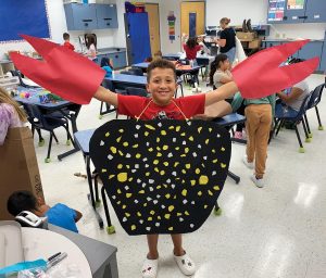 Students craft costumes and performing skits. Photo by Heather Kramer