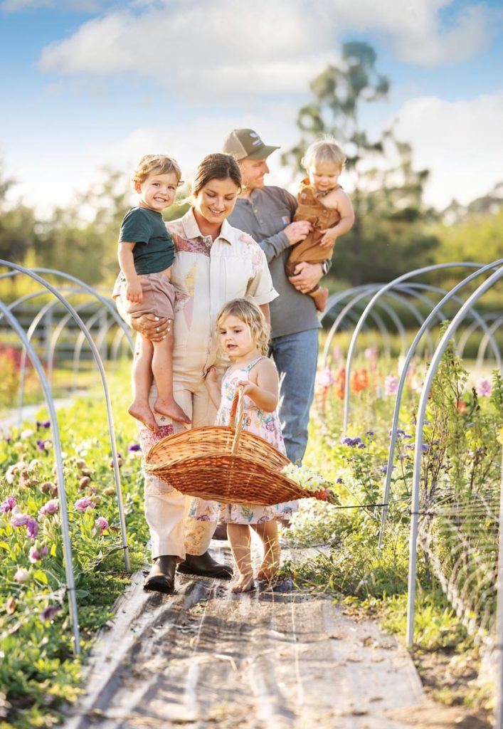 Strolls through the farm are learning experiences for the Greenlaw children, who learn flower names and enjoy the family time together. Photo by Sam Wolfe