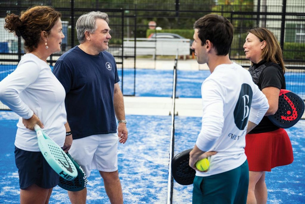 Annie Marcelle, Ed Shanaphy, Yarik Bahan, and Terri Randazzo gather at the net before playing a game. Photo by Steven Martine