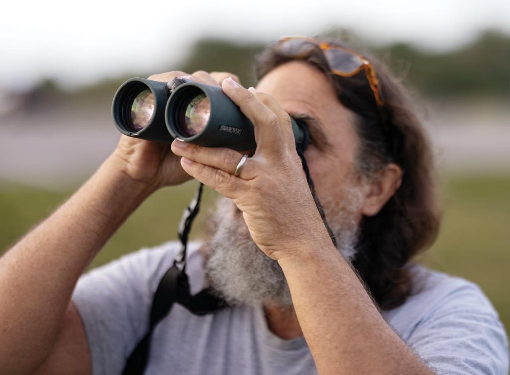 Birdwatching guide David Simpson enjoys spending time in the wild observing and identifying birds. Photo by Sam Wolfe