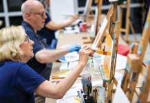 Vero Beach Museum of Art Honors Veterans Once class begins at the Vero Beach Museum of Art, Maryann Grodin and her classmates hang up their hats and get started painting. Photo by Steven Martine