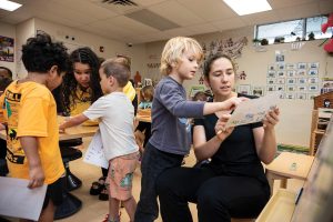 Skylar Schrock and Nikolai work on spelling. Photo by Steven Martine