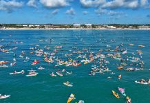 Making Waves During Swim to the Wreck The American flag, affixed atop the SS Breconshire off the coast of Vero Beach, is the spot where people gather on the Fourth of July. Photo by Joe Semkow