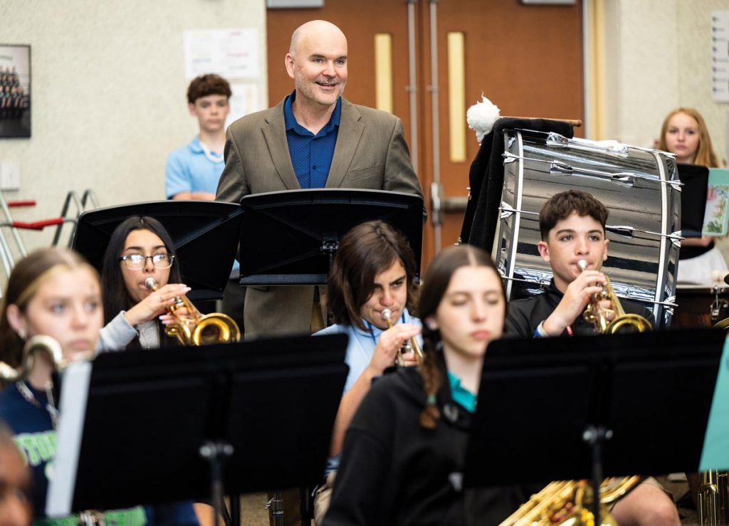 Moore enjoys a visit to a music class at Storm Grove. Photo by Steven Martine