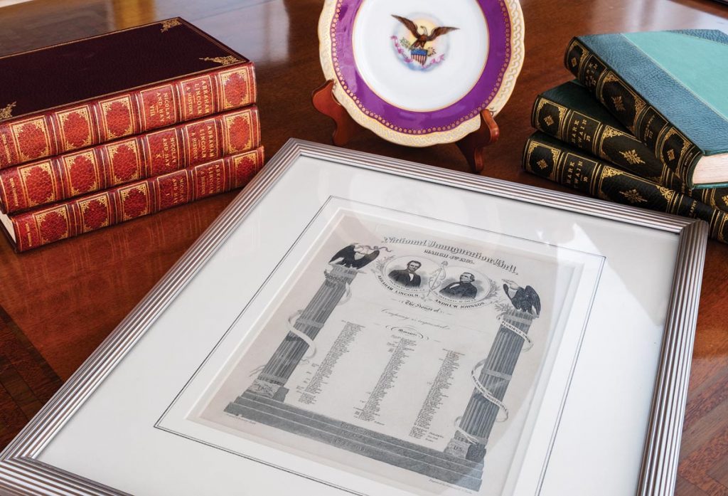 Abraham Lincoln’s 1865 inaugural invitation, a dessert plate from Lincoln’s White House, and books published on Lincoln in 1906. Photo by Jerry Rabinowitz