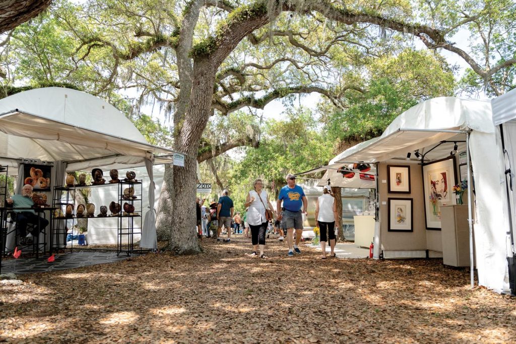 Even on the warmest days, attendees and artists are covered by cooling shade from the treasured oak canopy in Riverside Park. Photo by Anthony Castaldi at Perceived Media