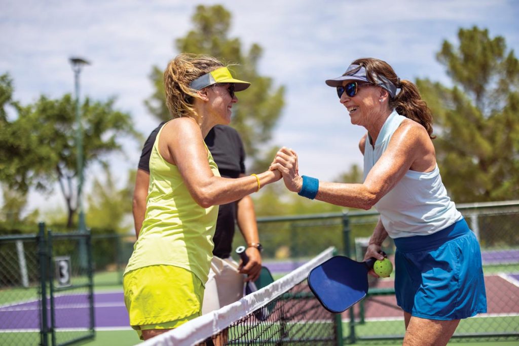The social aspect of pickleball is just as important as muscle-strength building. Photo courtesy of iStock