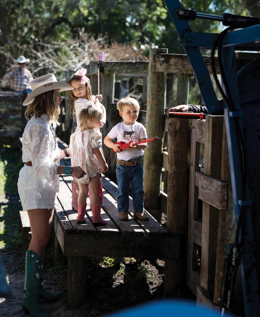 Emmy Tate, Mac, and Rymer all spend lots of time at the farm, while soaking up the scene and learning the ropes of Treasure Hammock Ranch under the watchful eyes of adults. Photo by Steven Martine
