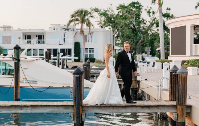 The newlyweds sneak away to the dock during dinner for some sunset photos. Photo by Jackie Watson, Ardensea