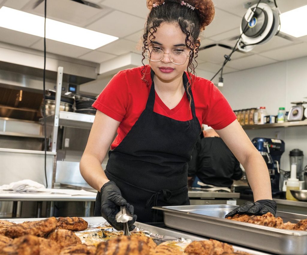 Students are introduced to various cooking methods and techniques as well as food safety principles. Photo by Steven Martine