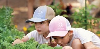 Zander and Evie show that children’s natural curiosity can be harnessed to teach them about nature and food sources. Photo by Steven Martine