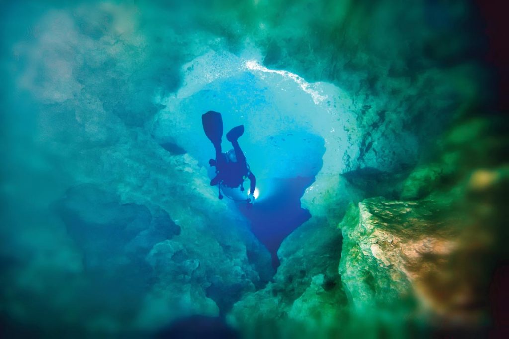 A cave diver explores a spring in Jackson County. Photo courtesy of AdobeStock