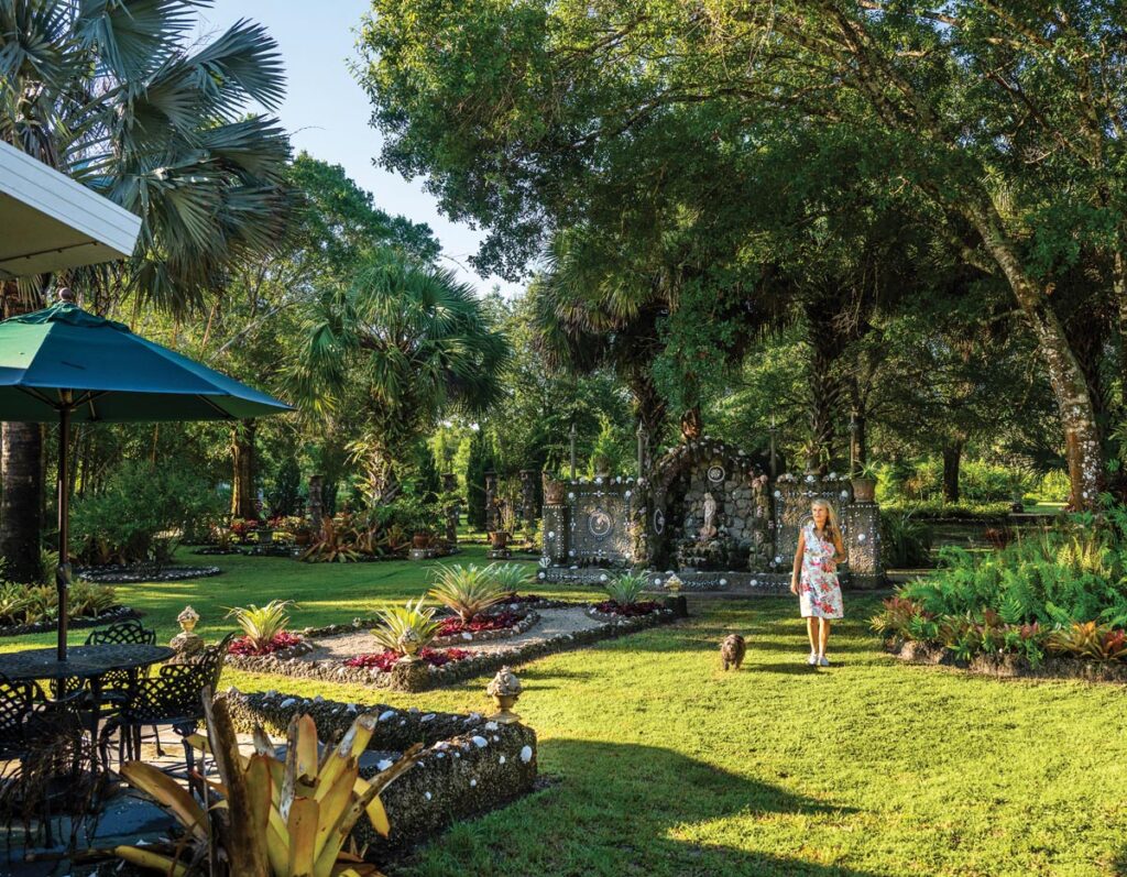 Cathi Bates walks among Il Giardino della Grotta. Photo by Steven Martine