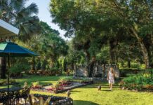Vero Beach Couple Creates a Grotto Garden in Their Backyard Cathi Bates walks among Il Giardino della Grotta. Photo by Steven Martine